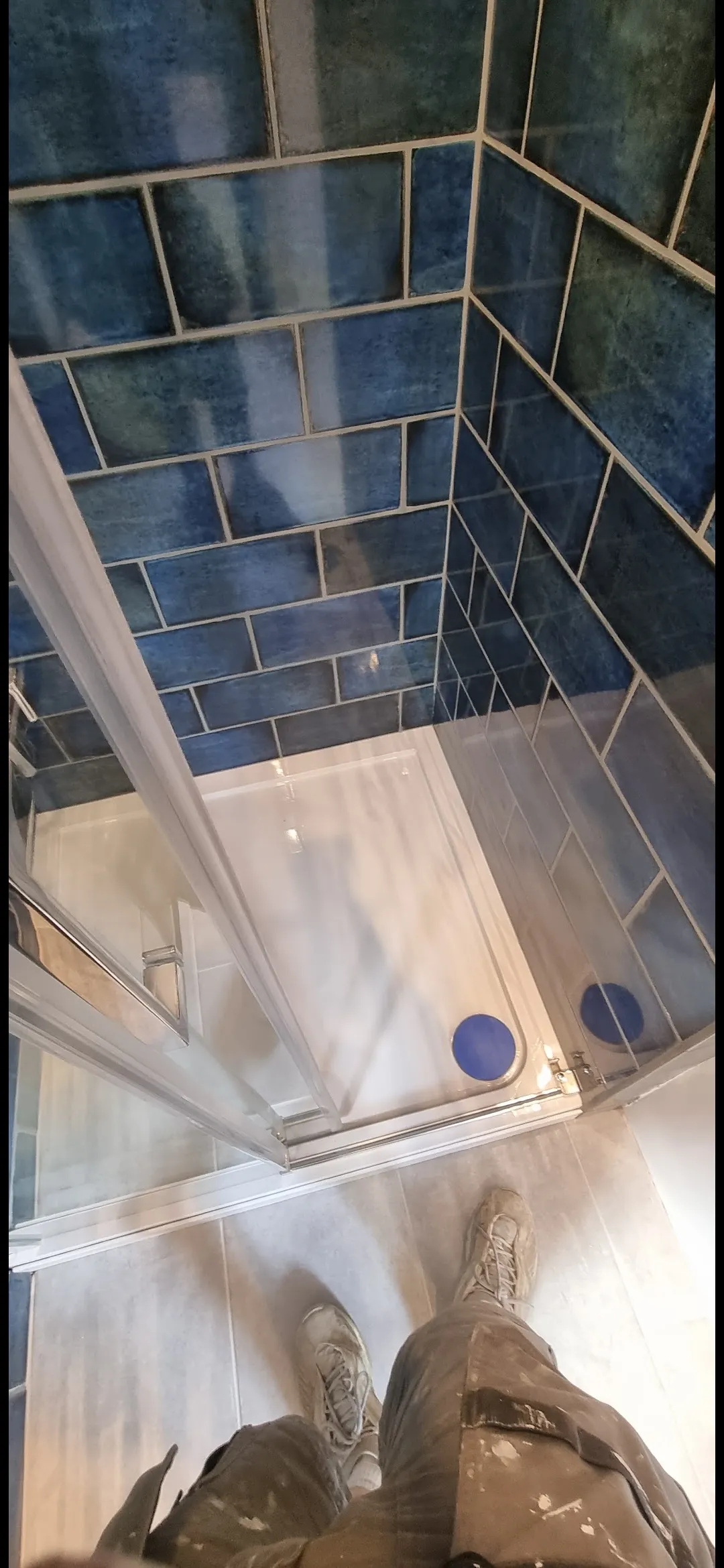 Bathroom black marble wet room shower tray with copper pipes — bathroom renovation Surrey