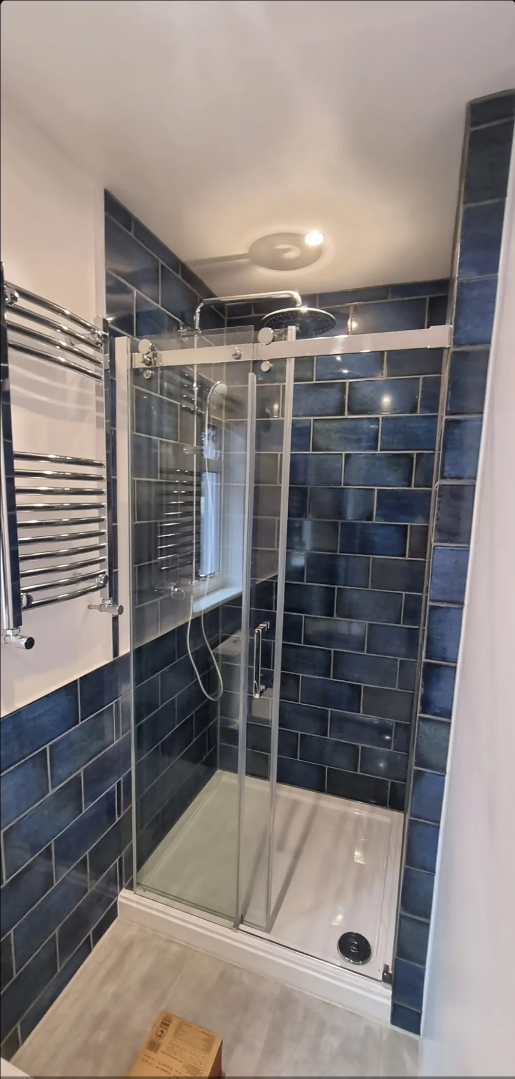 Bathroom blue metro tile shower POV overhead view — bathroom contractors Surrey